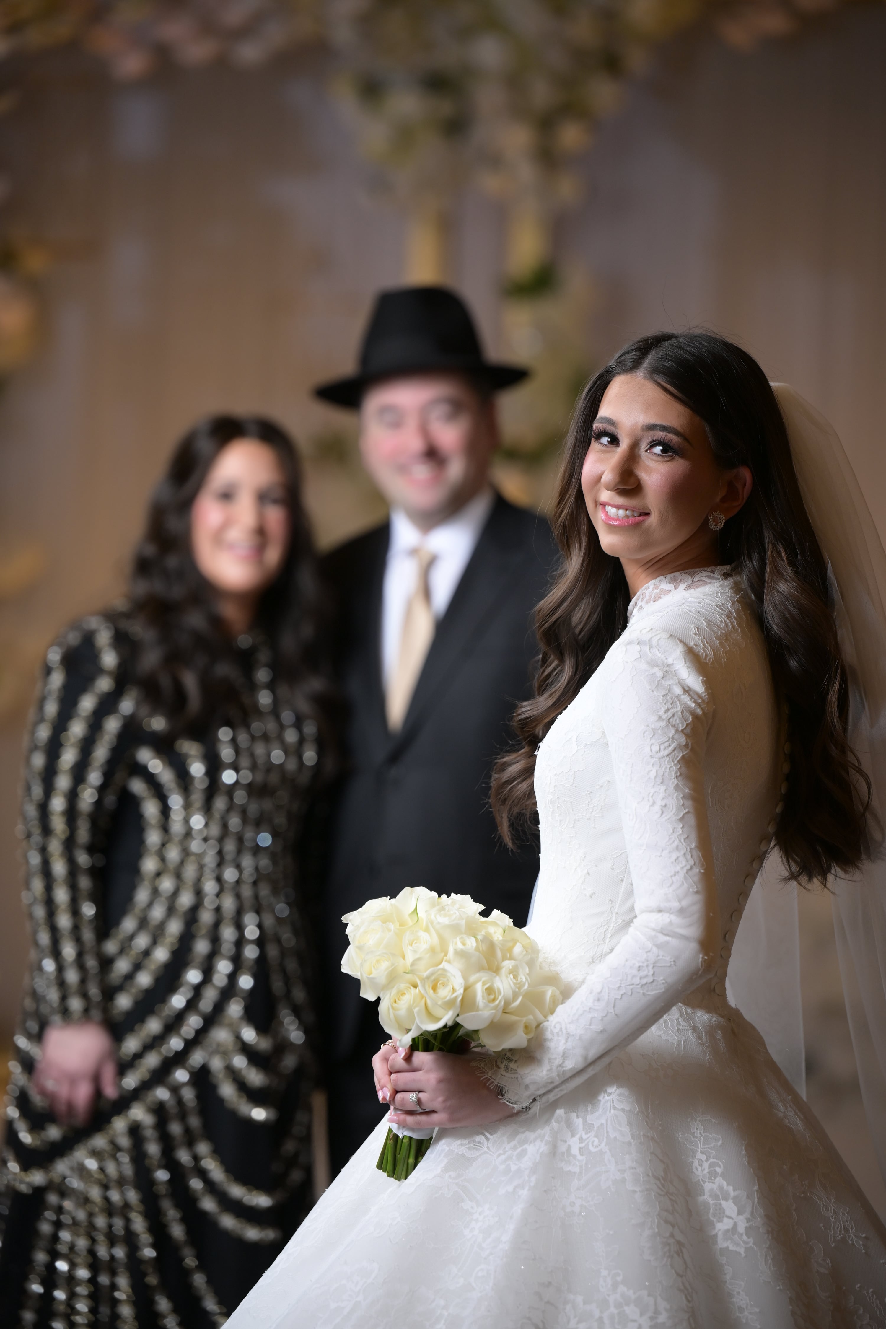 Bride photographed with parents