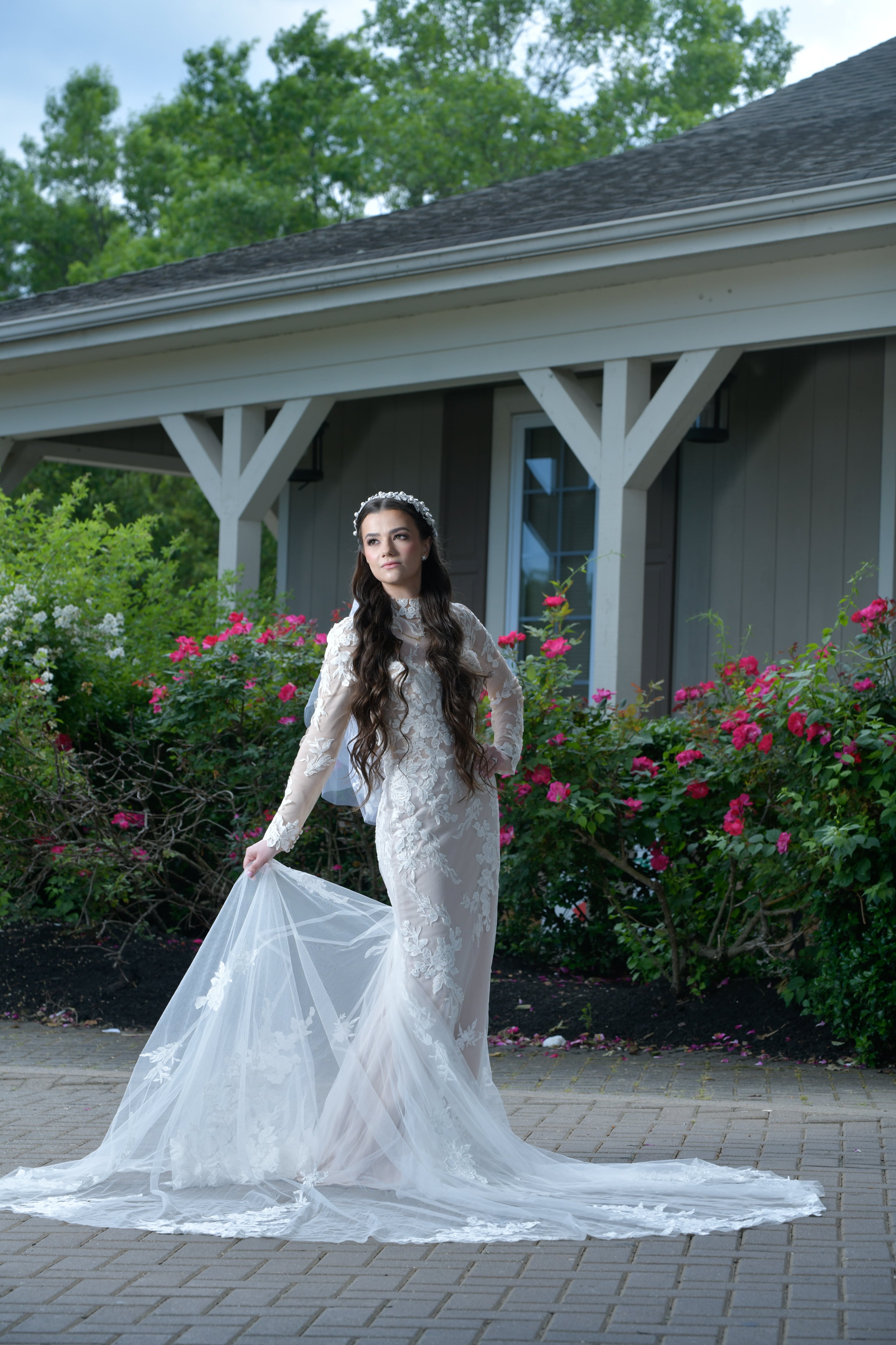 Outdoor lace gown bride with pink roses